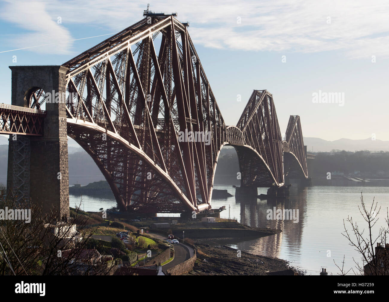 The Forth Rail Bridge viewed from the village of North Queensferry looking south over the Firth of Forth. Stock Photo