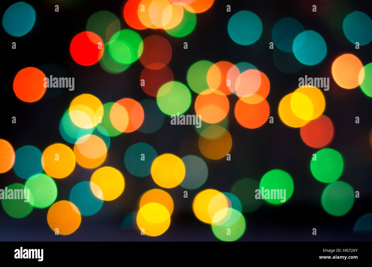 Colorful bokeh balls spread on dark background Stock Photo