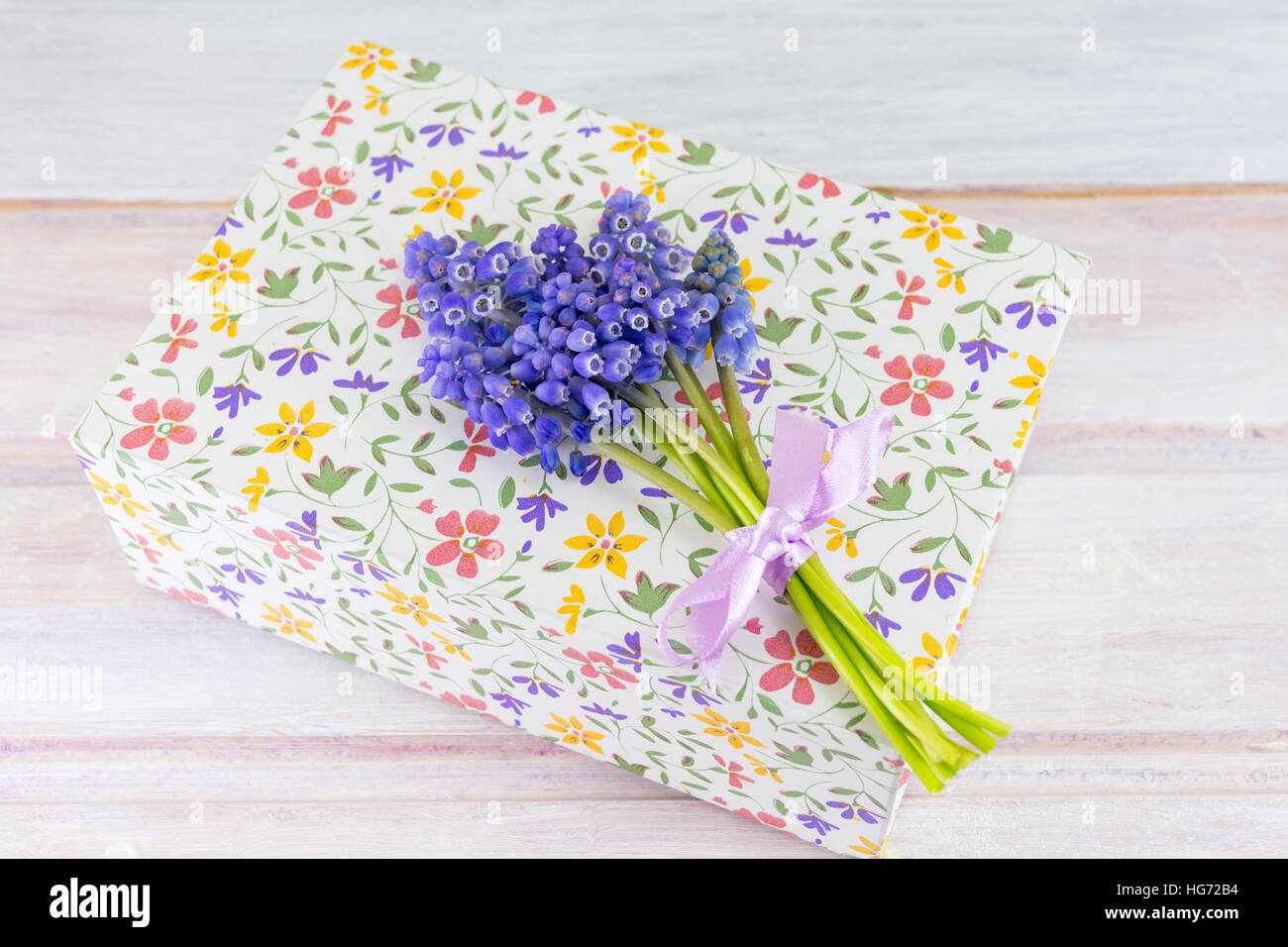 Bluebell spring flowers on top of flower pattern case Stock Photo