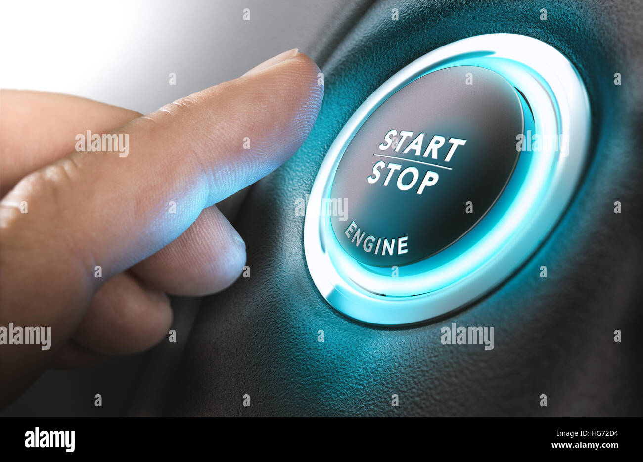 Car stop start system with finger pressing the button, horizontal image Stock Photo