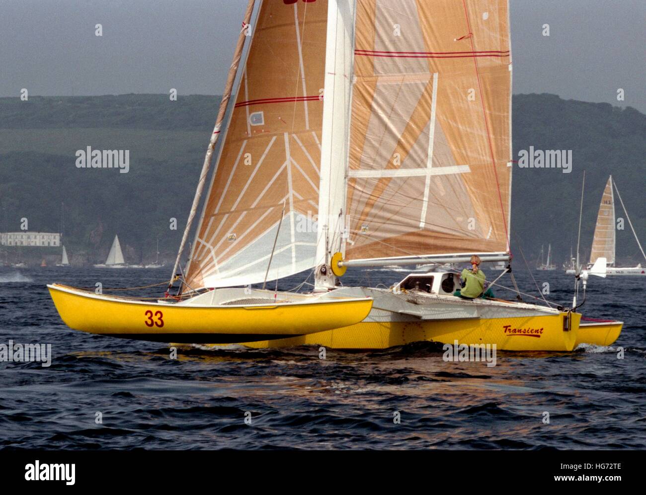 AJAXNETPHOTO. 7TH JUNE, 1992. PLYMOUTH, ENGLAND. - EUROPE 1 STAR - SINGLE HANDED TRANSATLANTIC RACE - BRITISH SKIPPER BRIAN THOMPSON SAILED THE 35FT CLASS V TRIMARAN TRANSIENT TO FIRST PLACE IN CLASS AT THE FINISH.   PHOTO:JONATHAN EASTLAND/AJAX REF:920706 6 14A Stock Photo