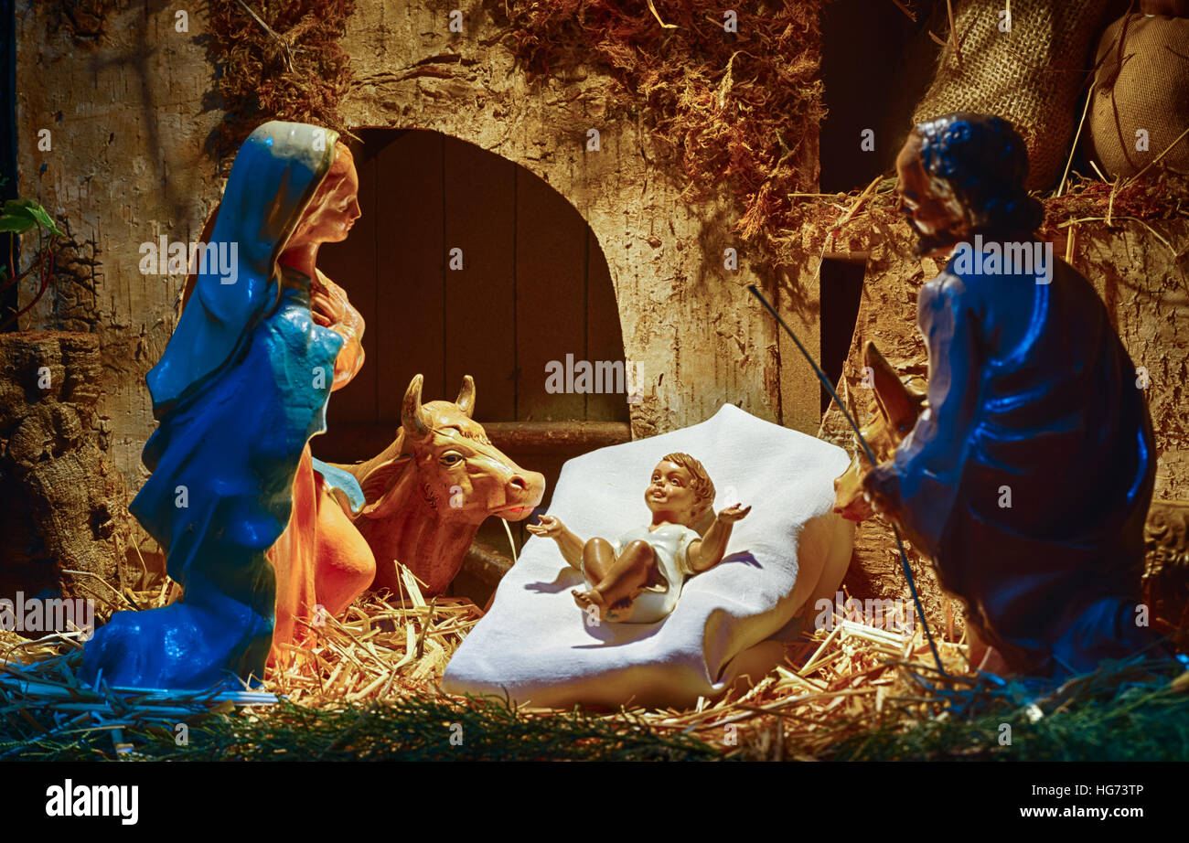 Christmas Nativity scene of baby Jesus in the manger with Saint Joseph ...