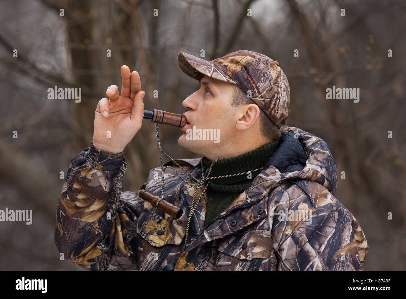 hunter with a wooden duck call Stock Photo Alamy