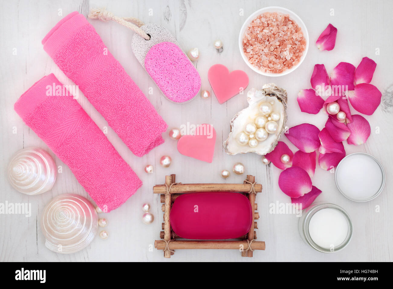 Rose petal spa skincare beauty treatment with himalayan salt, soap, flannels, moisturising cream