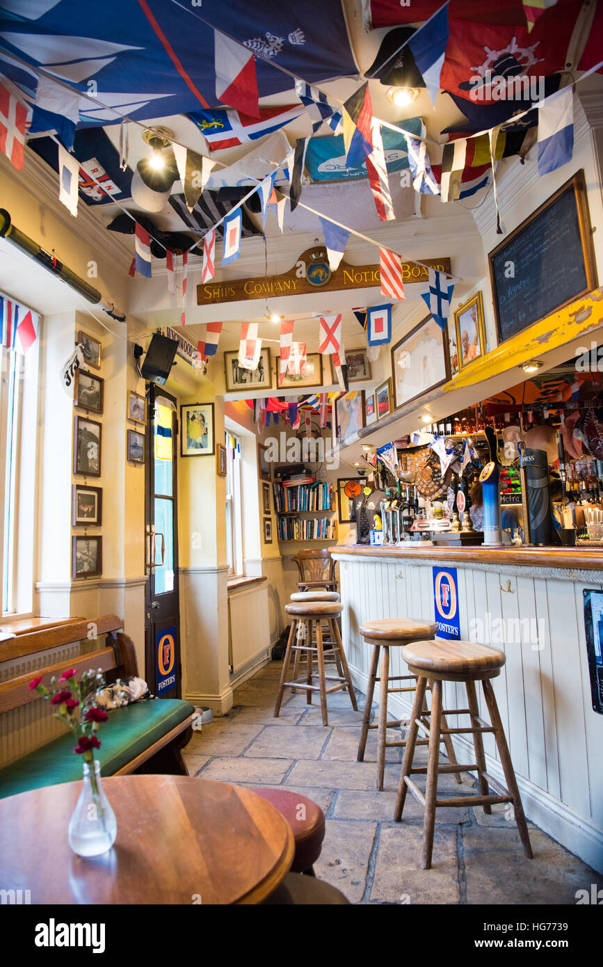 Inside view of the sailing-themed bar at the popular Dolphin Pub in Dartmouth, popular with sailors, crew, locals and holidaymakers Stock Photo