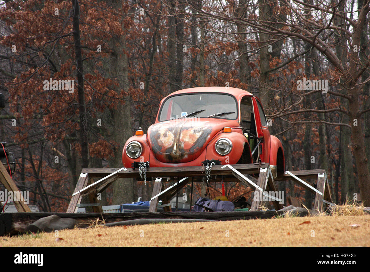 Old rusty Volkswagen beetle in yard Stock Photo