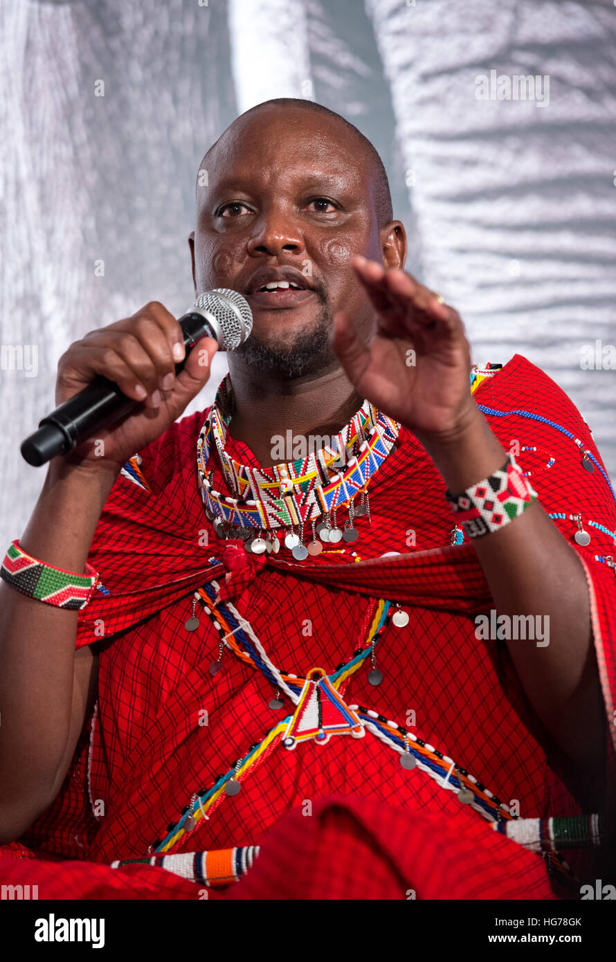 Masai warrior and representative of the Big Life foundation in Kenya,Daniel Ole Sambu,  talks to the guests at the Hope for Wildlife gala dinner Stock Photo