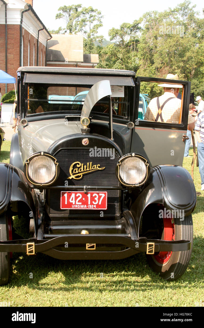 Retro/ vintage/ old/ antique car. Cadillac with open hood Stock Photo