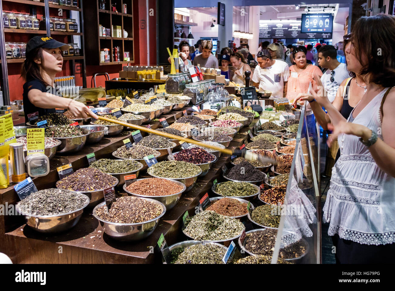 New York City,NY NYC Manhattan,Chelsea,Chelsea Market,Spices & Tease,spice store,loose leaf tea,display bowls,Asians adult adults,woman female women,w Stock Photo