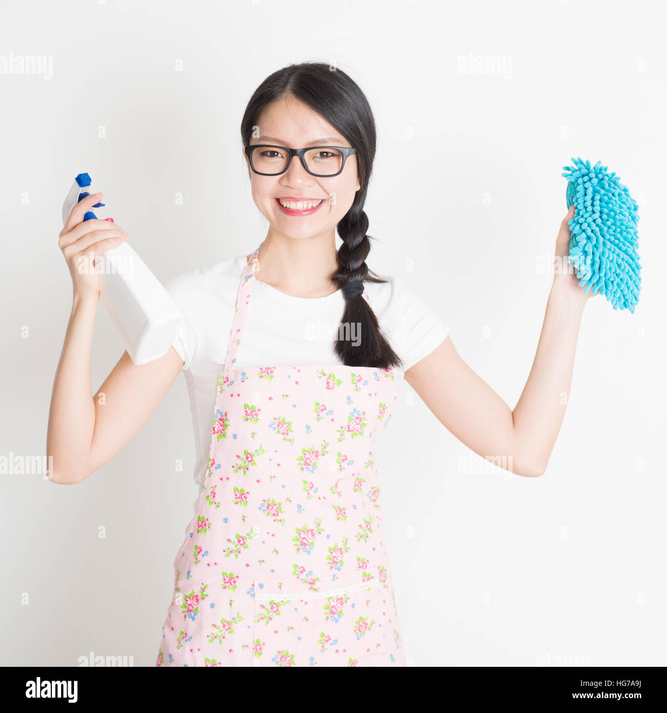 Young Asian woman preparing to do house cleaning. Hand holding