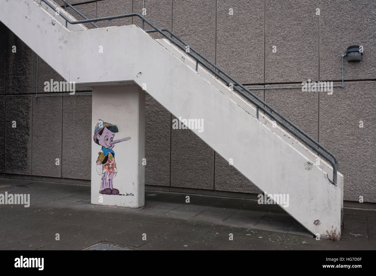 The Disney cartoon character Pinoccio, beneath concrete stairs on the Aylesbury Estate, on 4th January, London borough of Southwark, England. Stock Photo