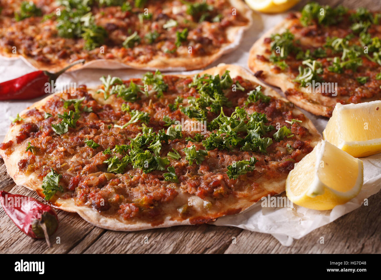 Turkish Food: lahmacun closeup on a wooden table. Horizontal Stock Photo