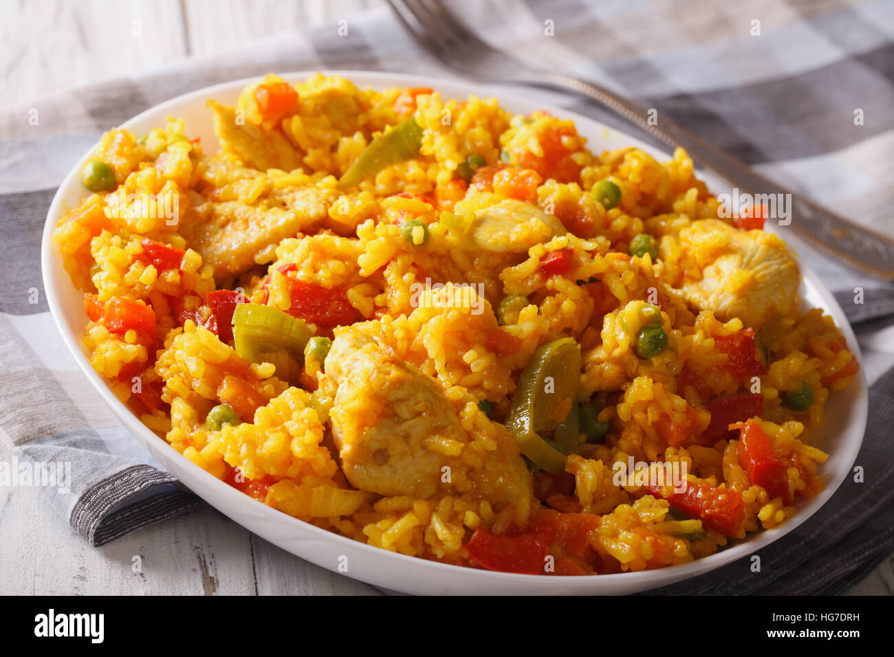 Hispanic food: Arroz con pollo - rice with chicken close up in a bowl ...