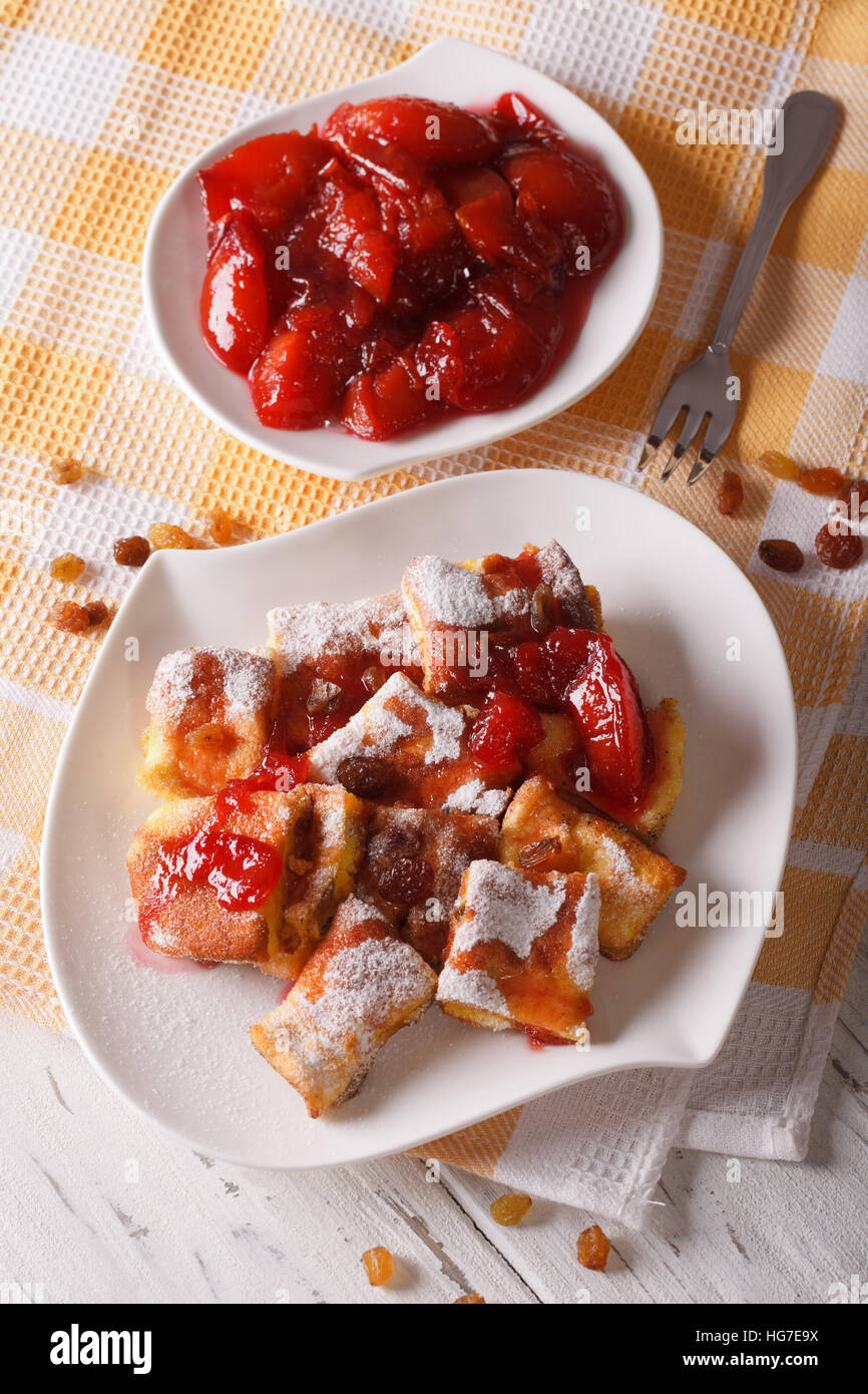 Sweet Kaiserschmarrn and plum sauce close-up on a plate. vertical Stock Photo
