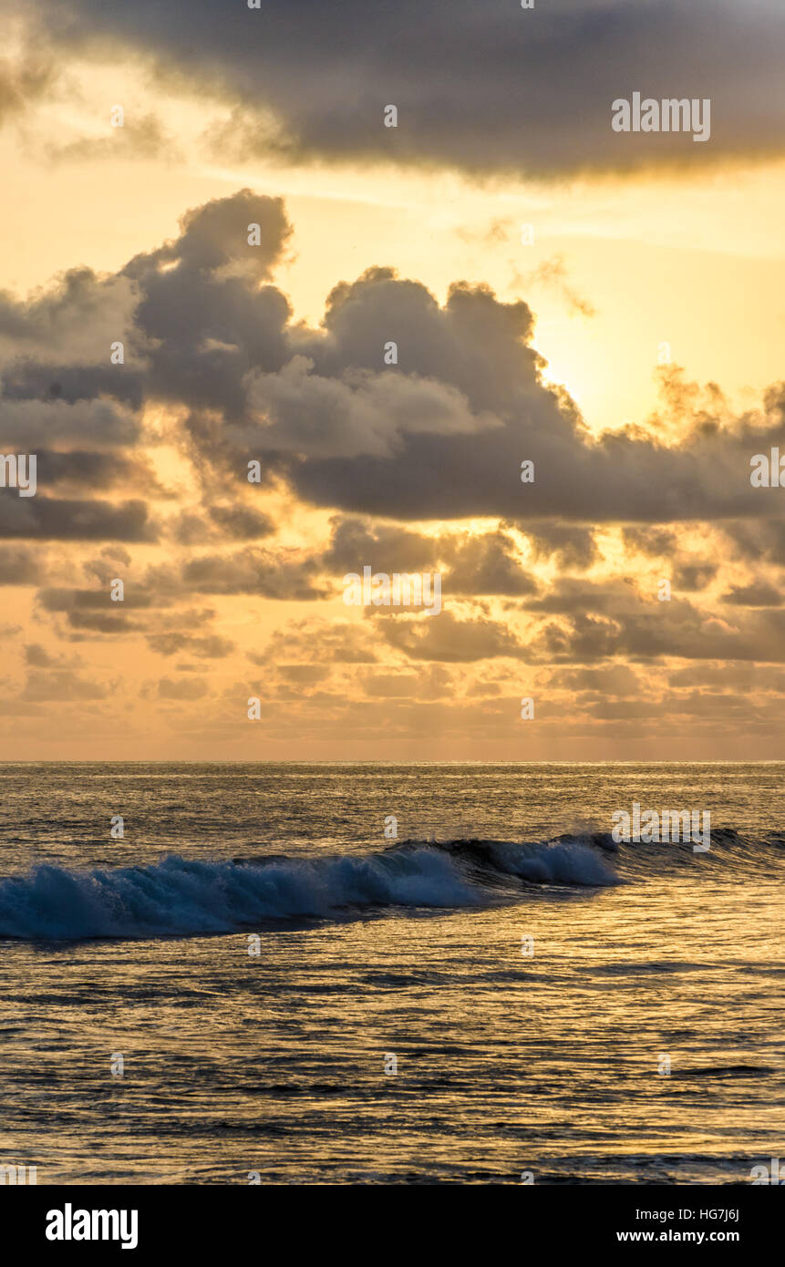 Dramatic sunset over Atlantic ocean with cloudy sky at Limbe, Cameroon, Africa Stock Photo
