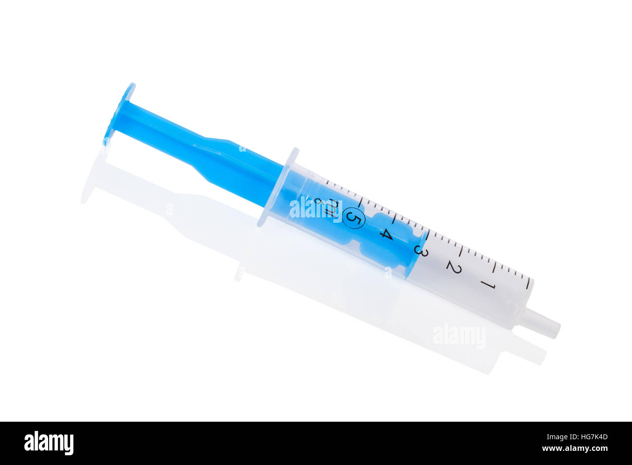 Small disposable syringe made of plastic, with a half full barrel and plunger in the middle of the scale, isolated on white Stock Photo