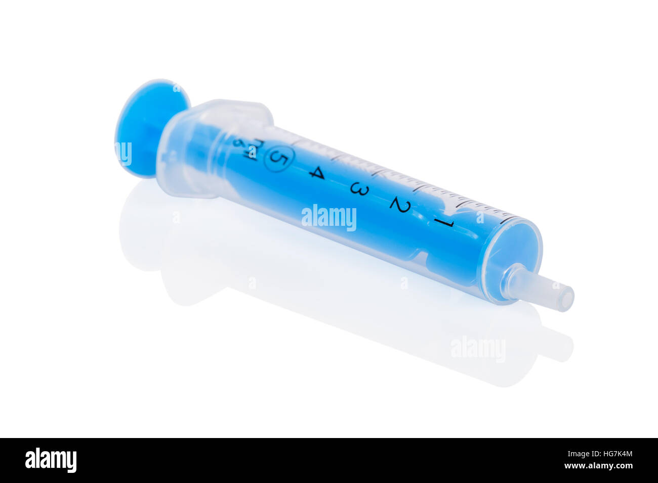 Small disposable syringe made of plastic, with an empty barrel and plunger on the bottom of the scale, isolated on white Stock Photo