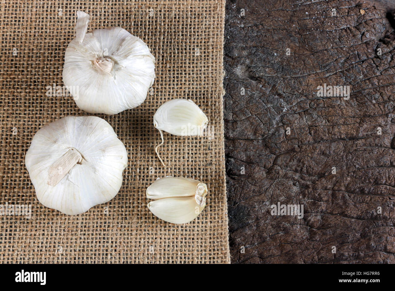 Garlic cloves on a vintage wooden background Stock Photo - Alamy