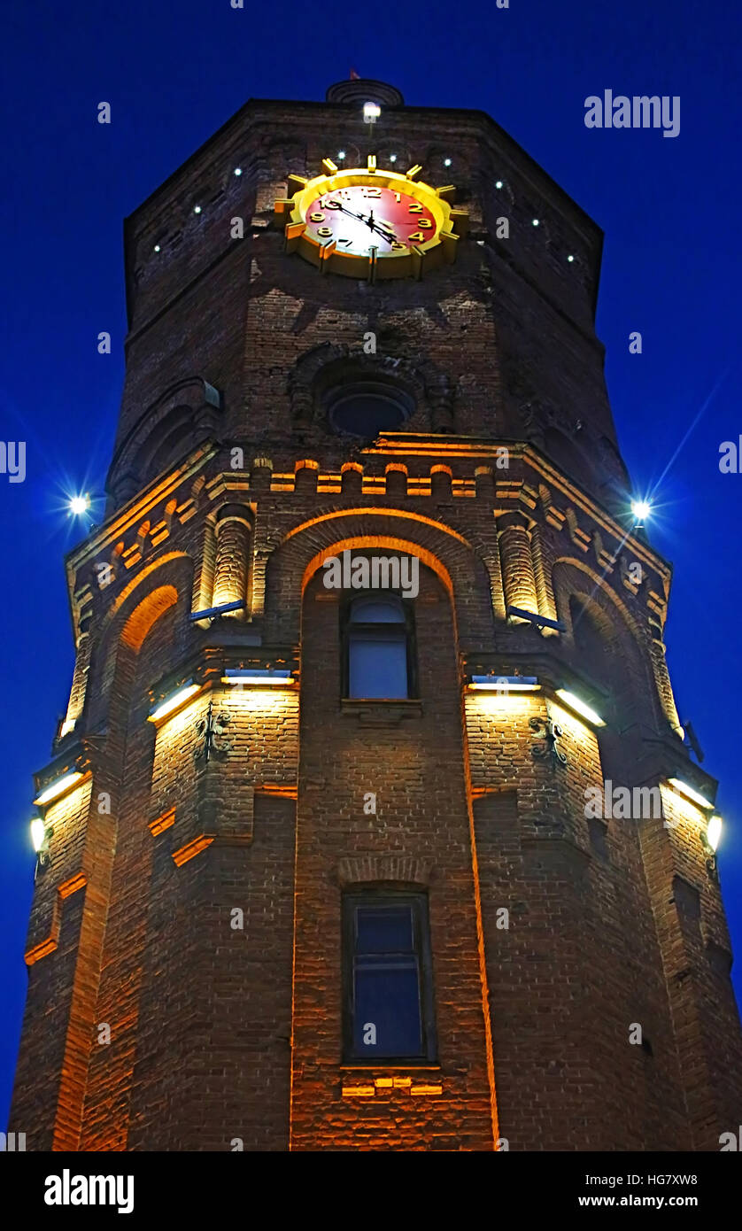 Old fire tower with clock at night in Vinnytsia, Ukraine Stock Photo