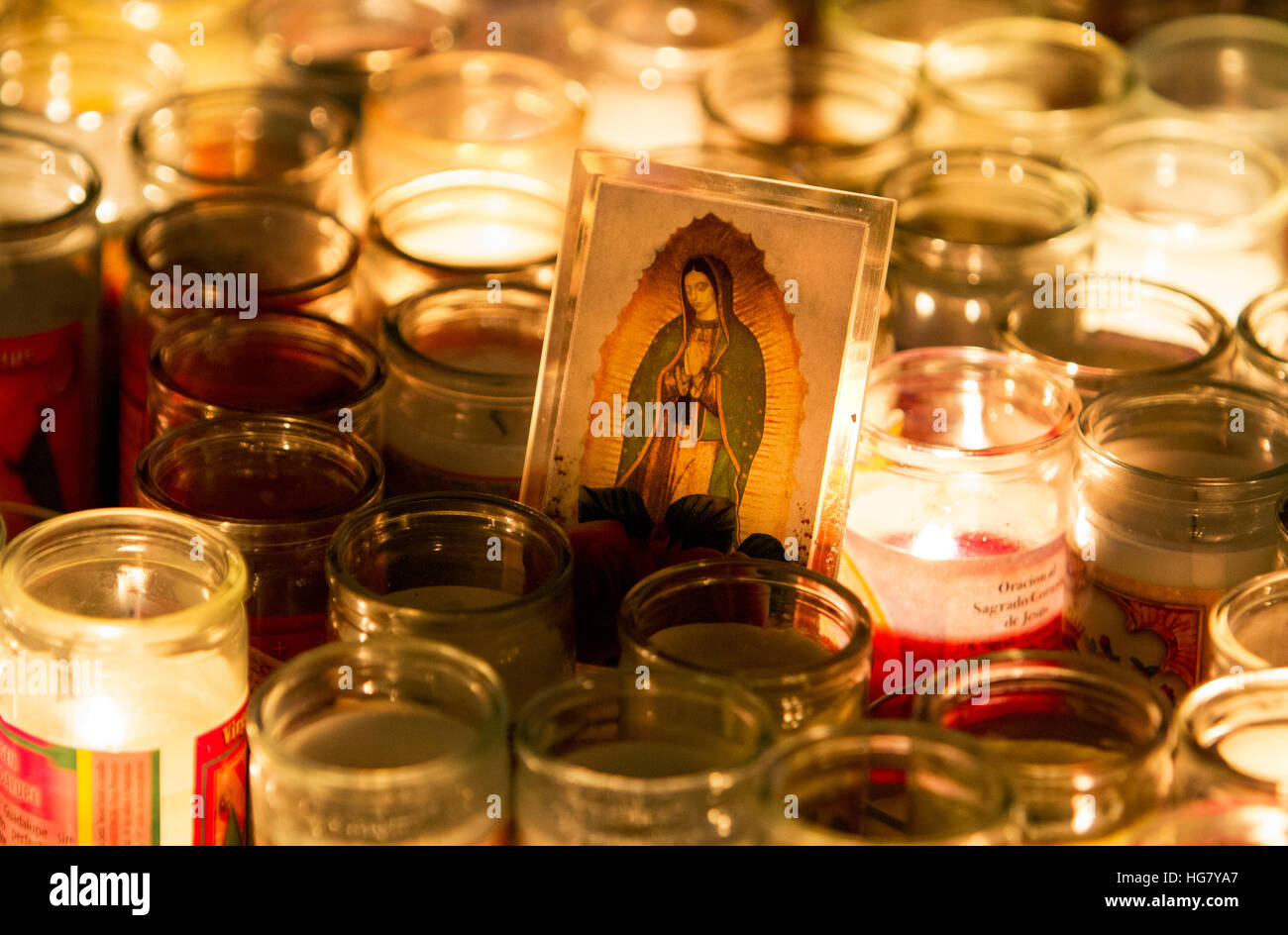 Votive candles are lit during the Feast of Our Lady of Guadalupe