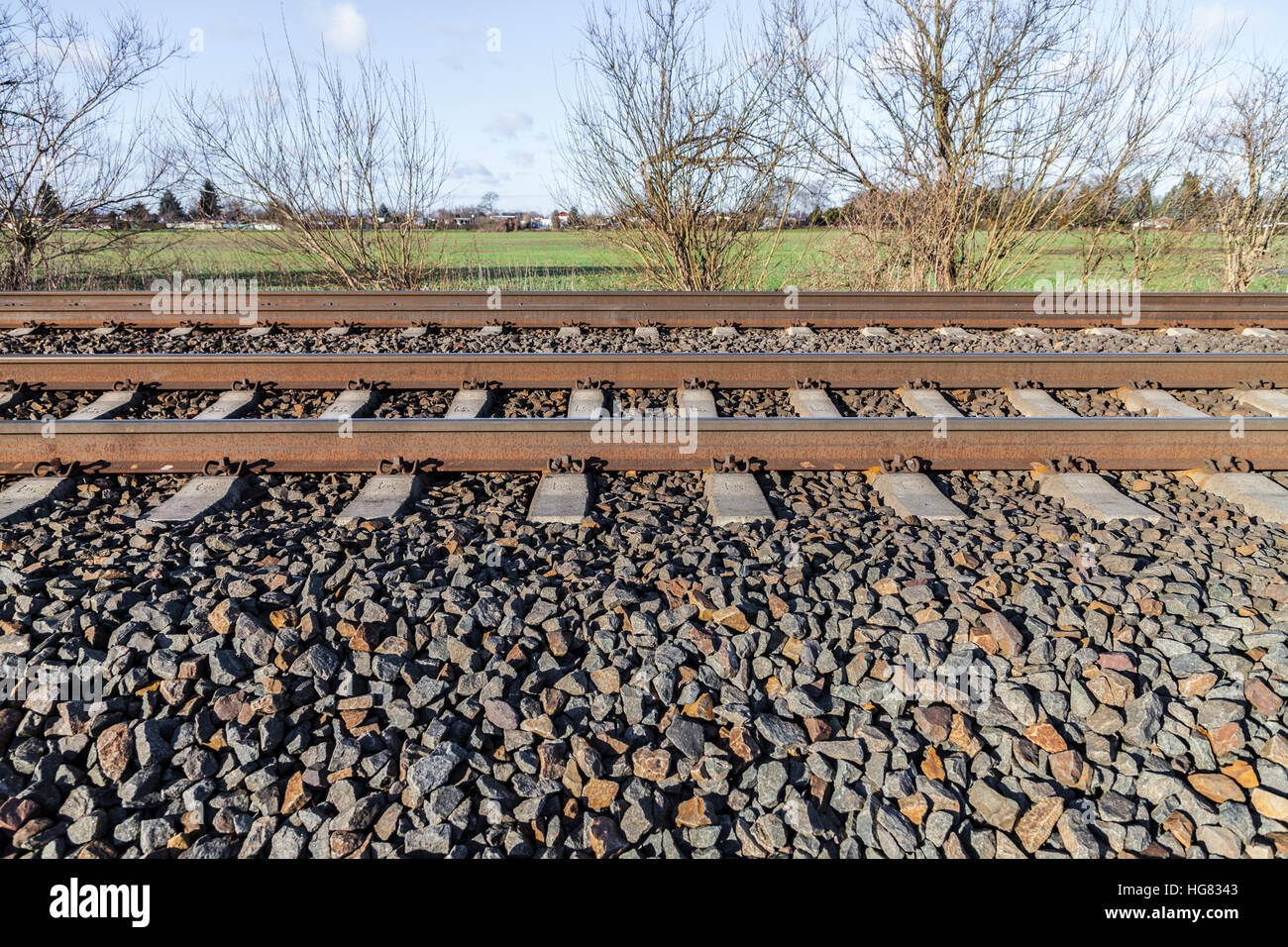 german rail road line lies on stones Stock Photo