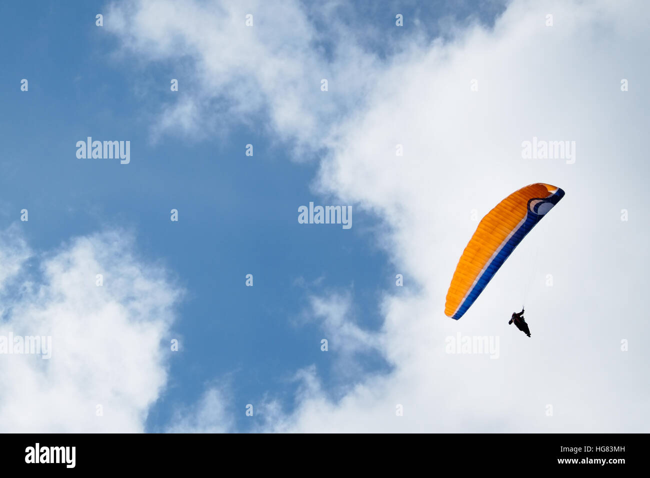 Paragliding over cloudy sky background -0 Stock Photo