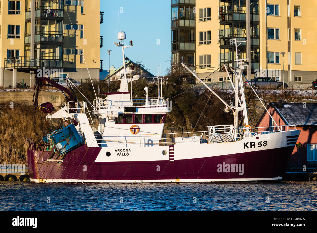 Karlskrona, Sweden - January 5, 2017: Documentary of fishing industry. The fishing boat KR 58 Arcona moored dockside in Saltö harbor, Karlskrona. Yell Stock Photo