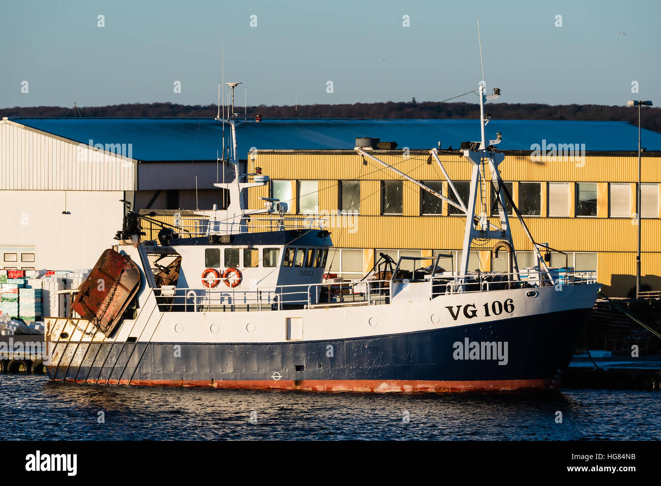 Karlskrona, Sweden - January 5, 2017: Documentary of fishing industry. The fishing boat VG 106 Theseus moored dockside in Saltö harbor, Karlskrona. Ye Stock Photo