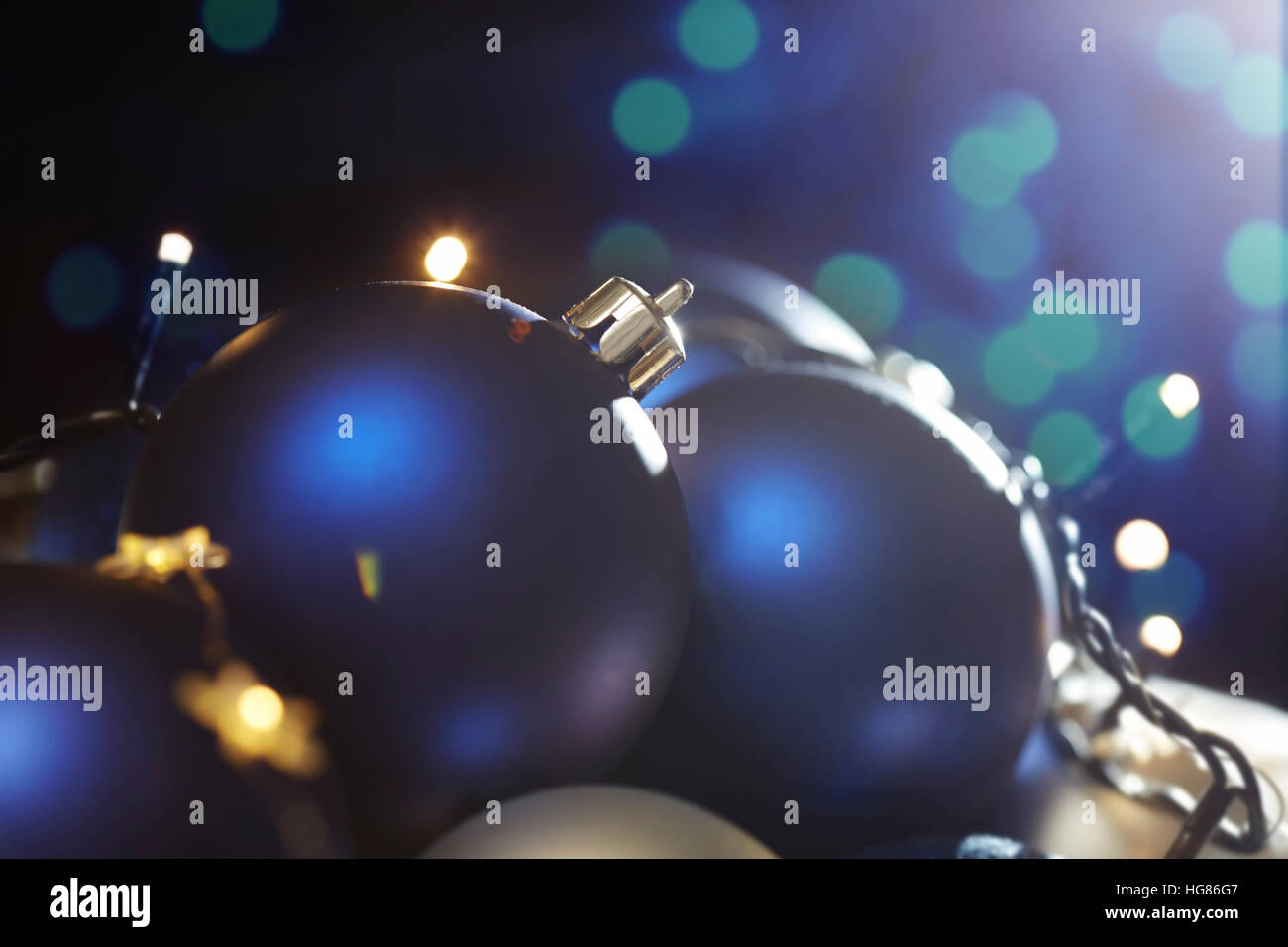 Close-up of christmas baubles with fairy lights Stock Photo