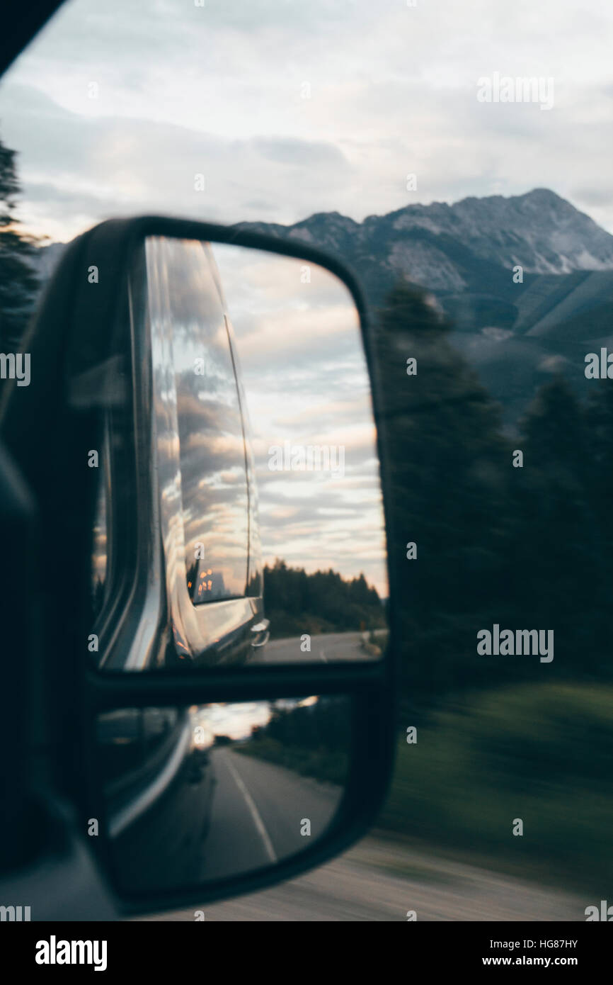 Cloudy sky reflecting on sideview mirror of car Stock Photo Alamy