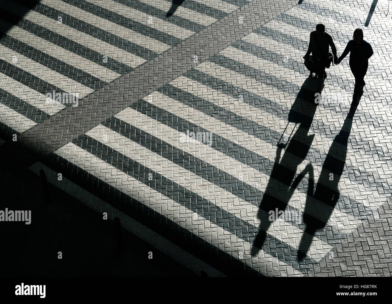 Two people crossing road silhouette hires stock photography and images