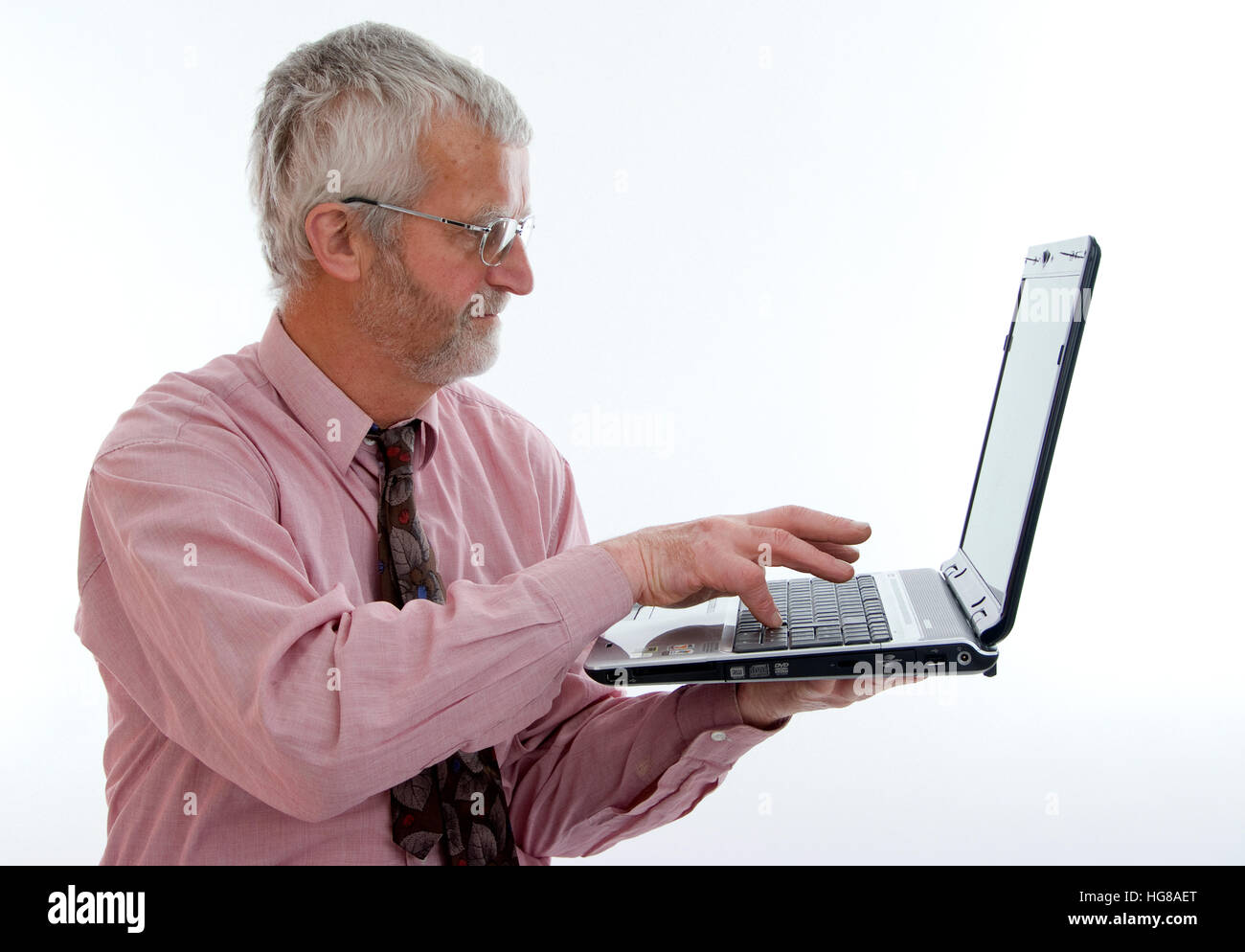 Retiree with laptop Stock Photo - Alamy