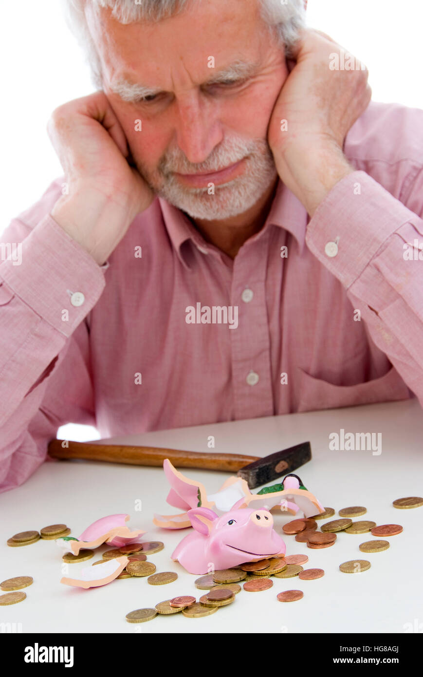 Retiree robs the piggy bank Stock Photo