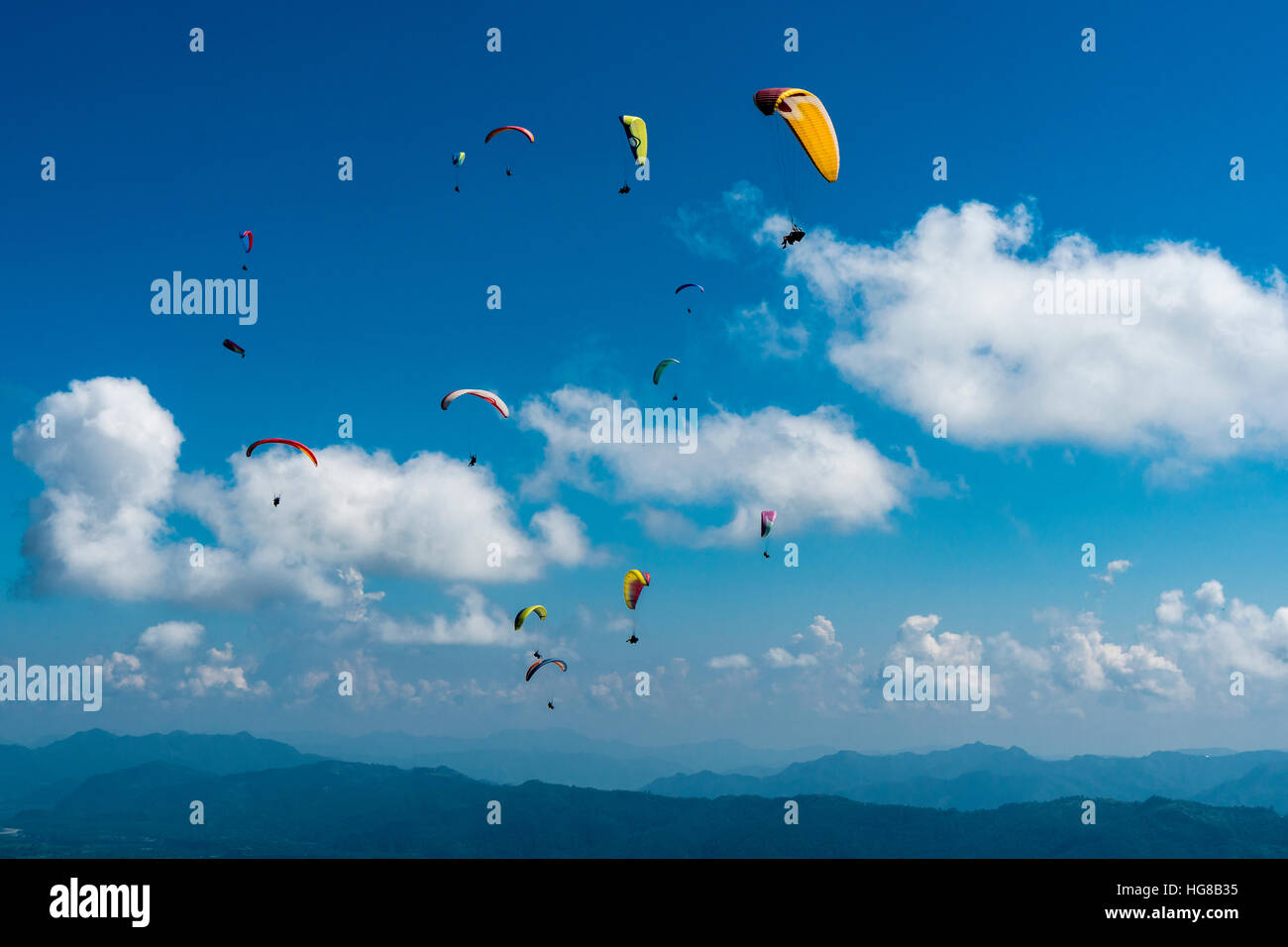 Many paragliders are flying over Pokhara and Phewa Lake, Sarangkot, Kaski District, Nepal Stock Photo