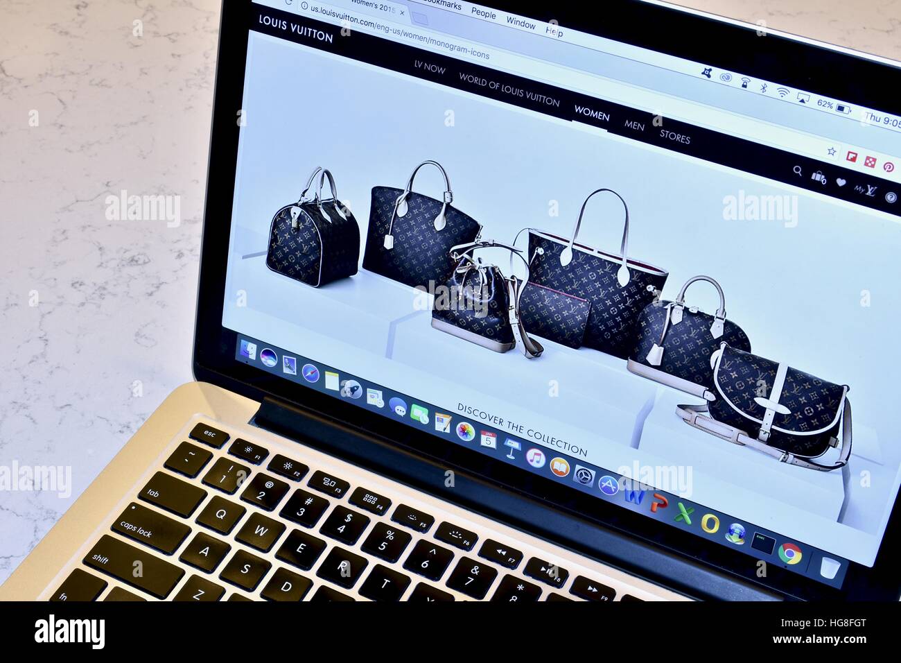 The Louis Vuitton website displayed on an Apple Macbook Pro Stock