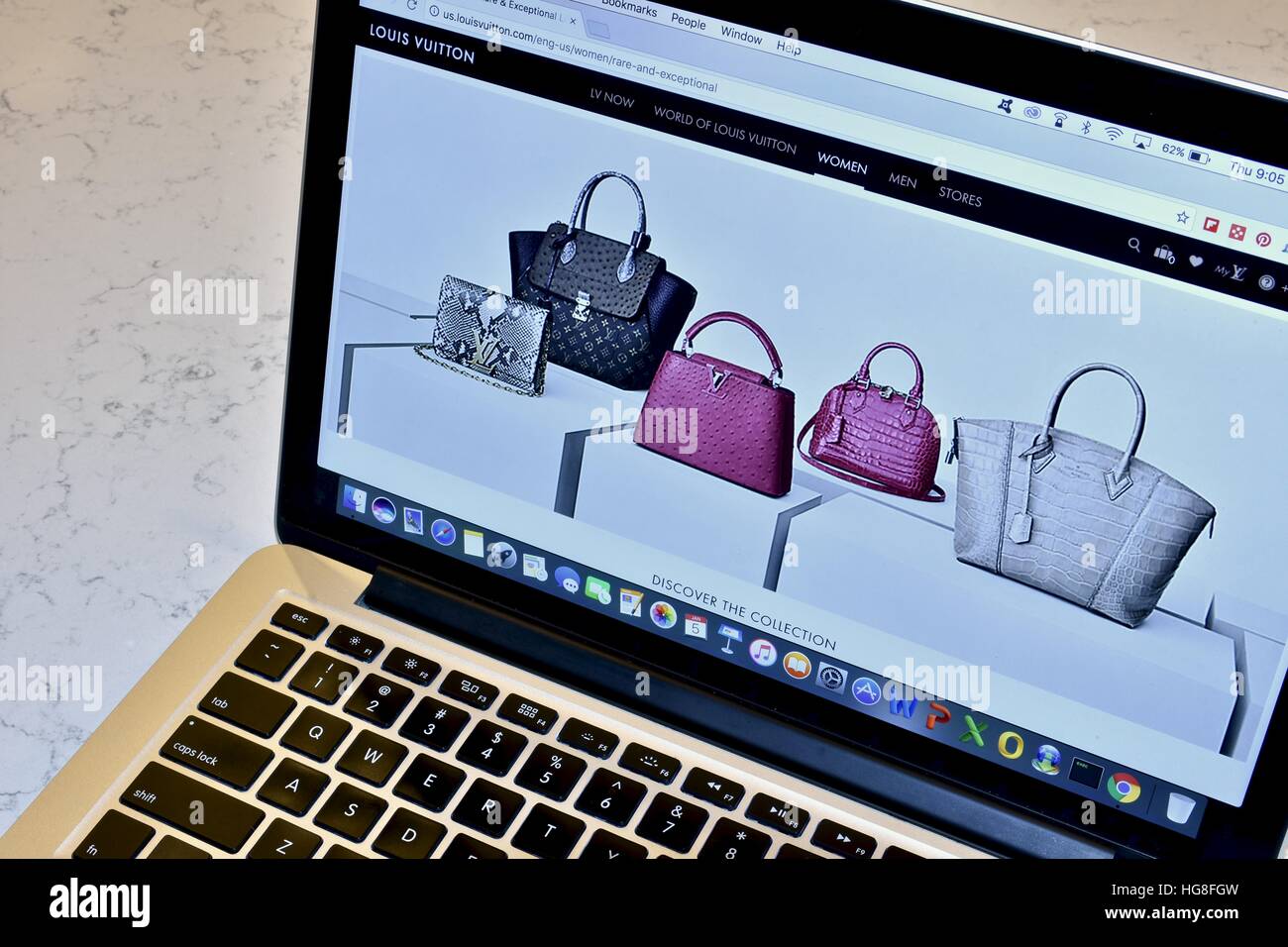 The Louis Vuitton website displayed on an Apple Macbook Pro Stock