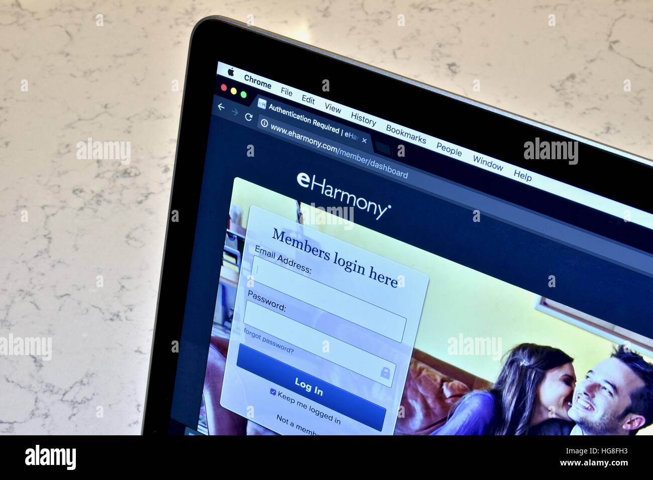 An Apple Macbook pro displaying the eHarmony dating website Stock Photo