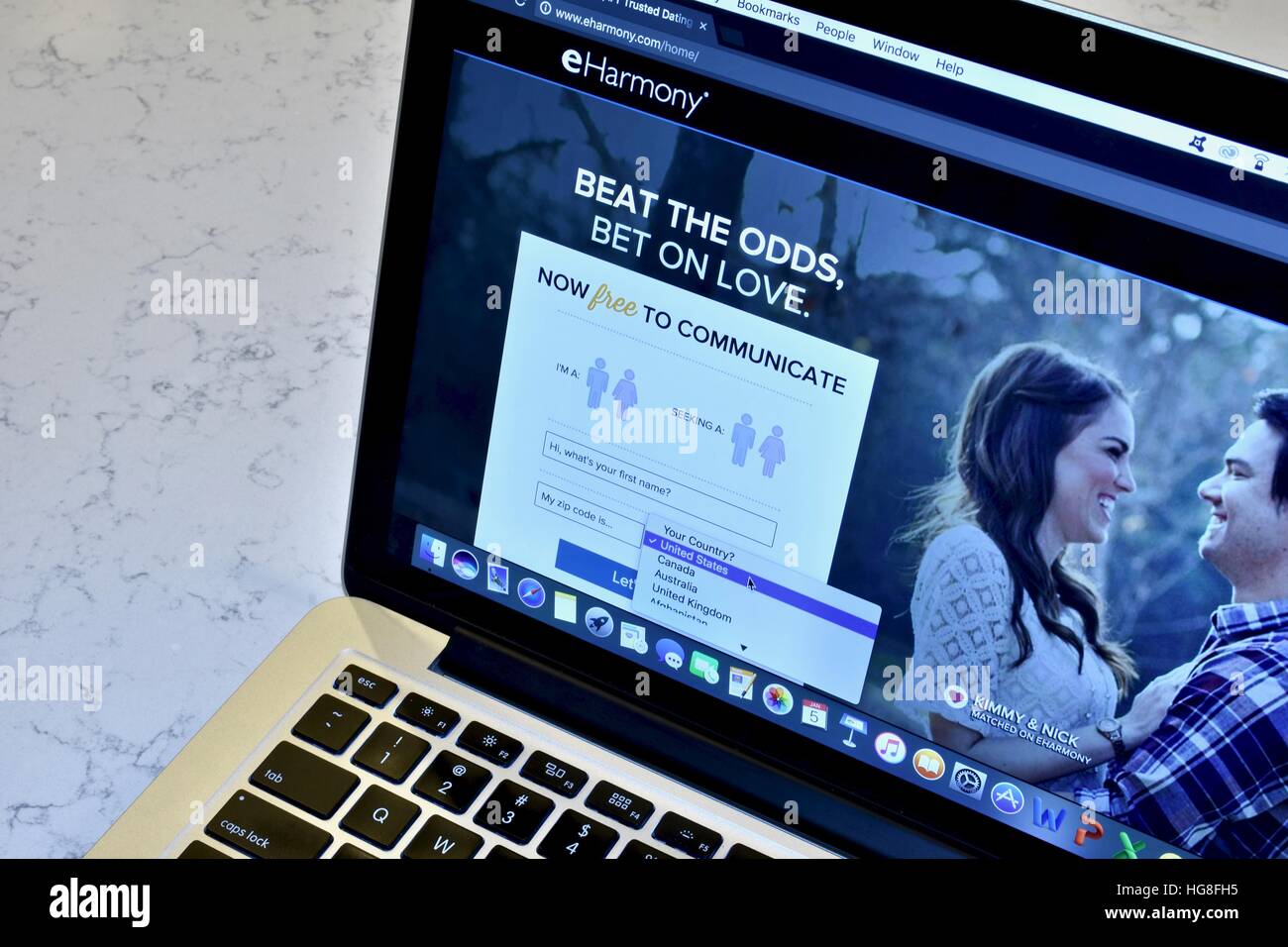 An Apple Macbook pro displaying the eHarmony dating website Stock Photo