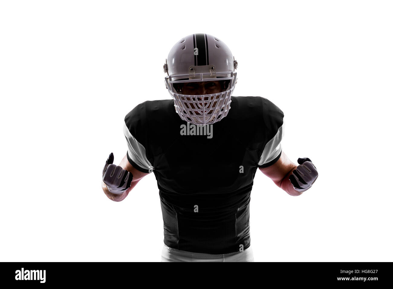 Football Player with a Black uniform on a white background Stock Photo