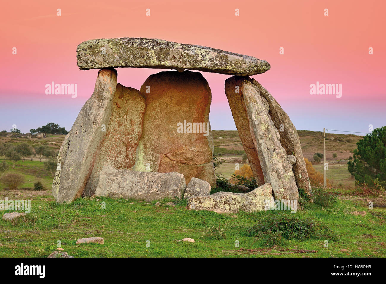 Megalithic stone grave dolmen (portuguese=anta) with scenic horizon in the background Stock Photo