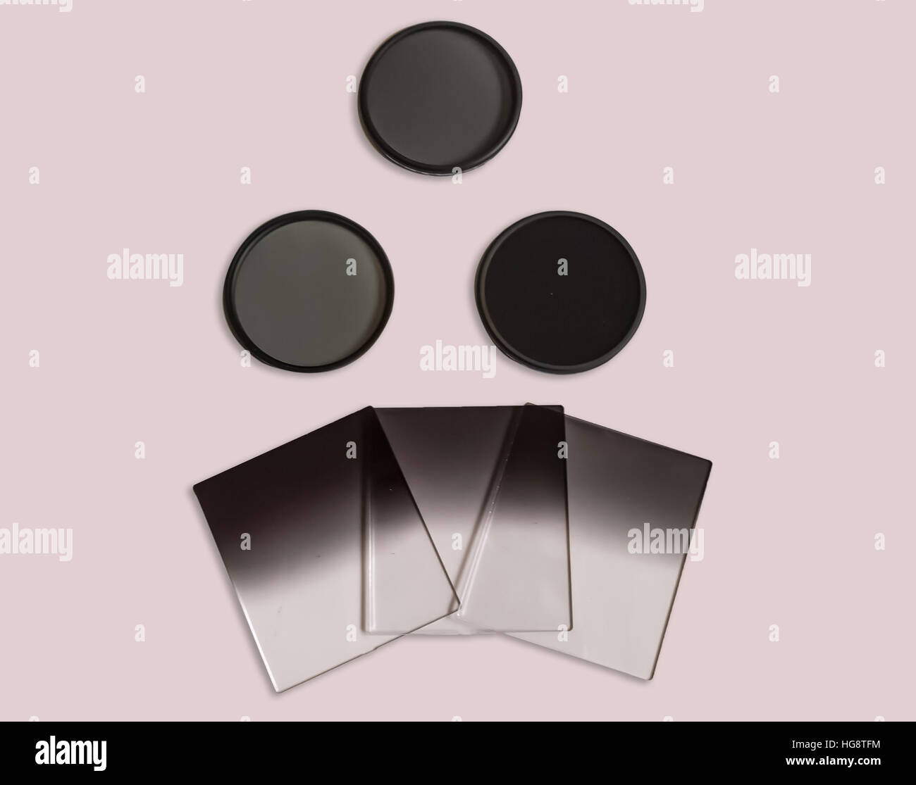 Neutral density and graduated neutral density filters used in camera for photography isolated. Stock Photo