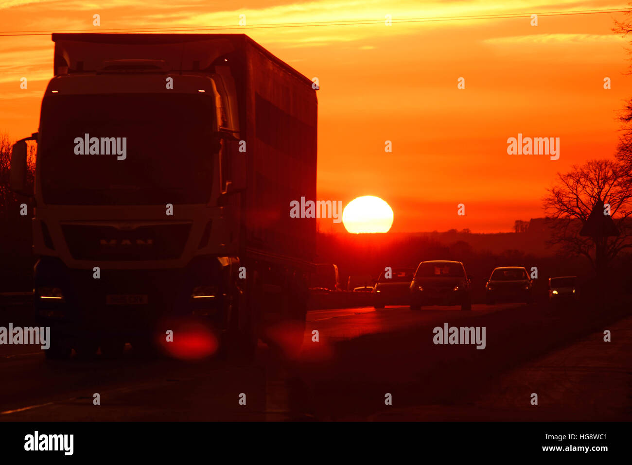 lorry travelling at sunset on the A64 dual carriageway york yorkshire united kingdom Stock Photo