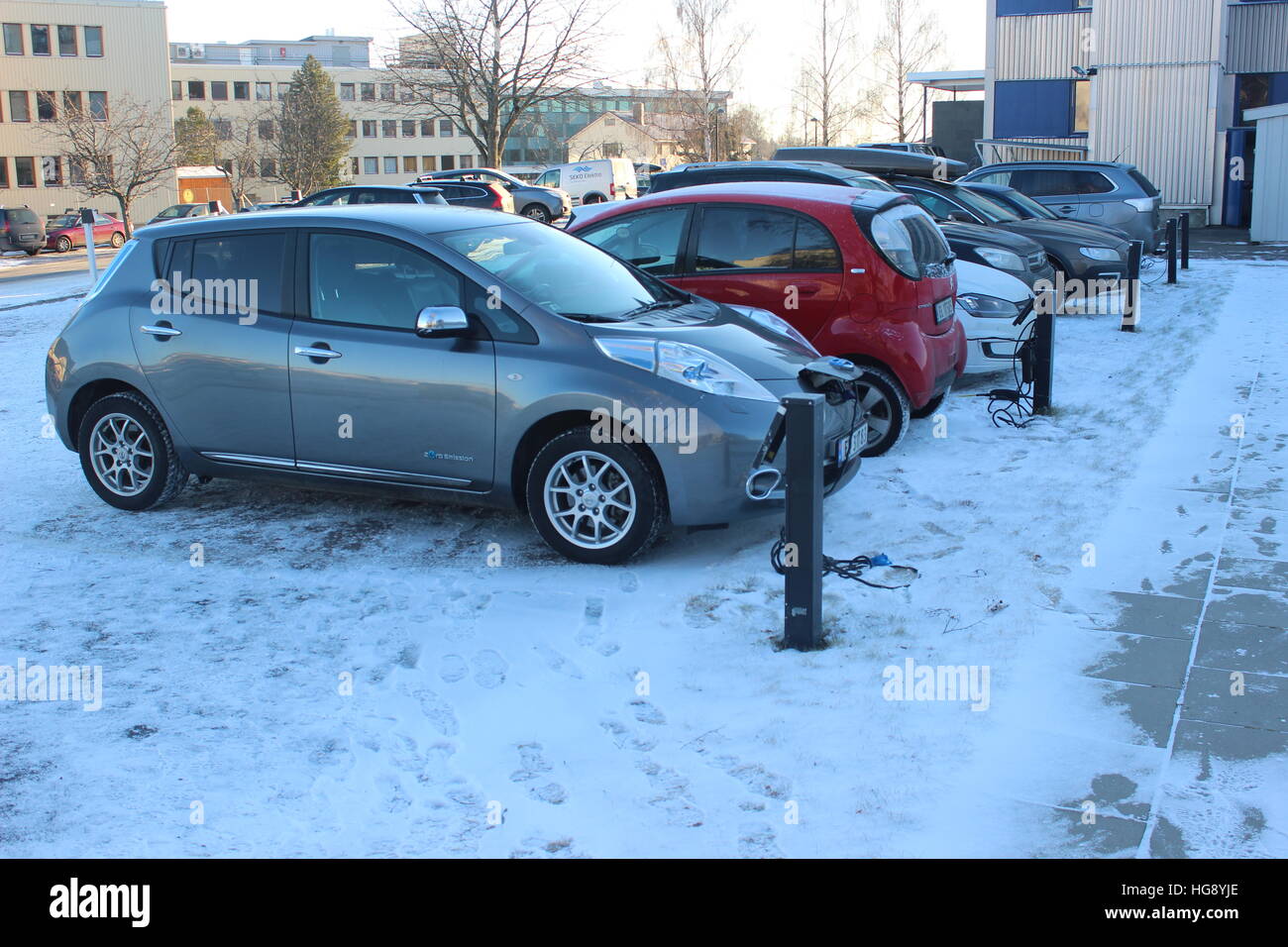 Electric cars charging in the cold weather in Norway Stock Photo