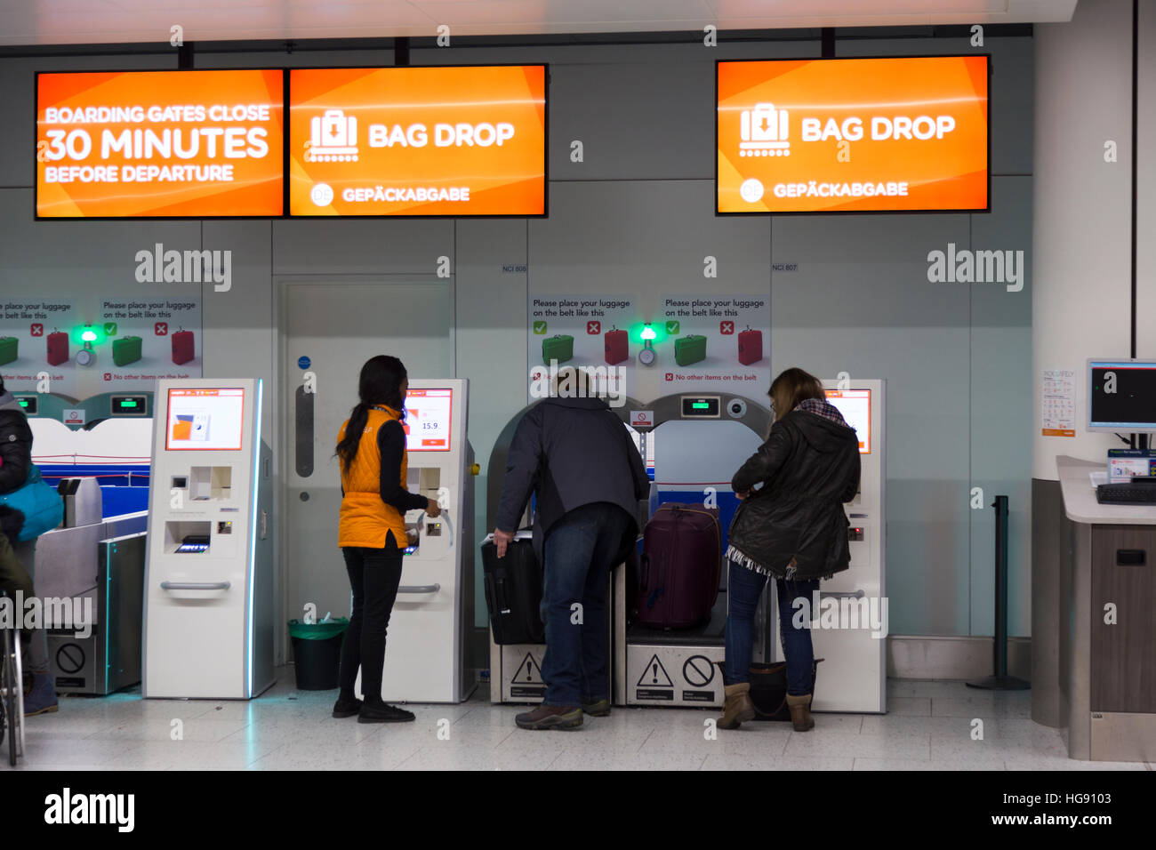 Easyjet passenger bag drop baggage dropping off point for luggage check in to be checked into hold on flight. Gatwick Airport UK Stock Photo