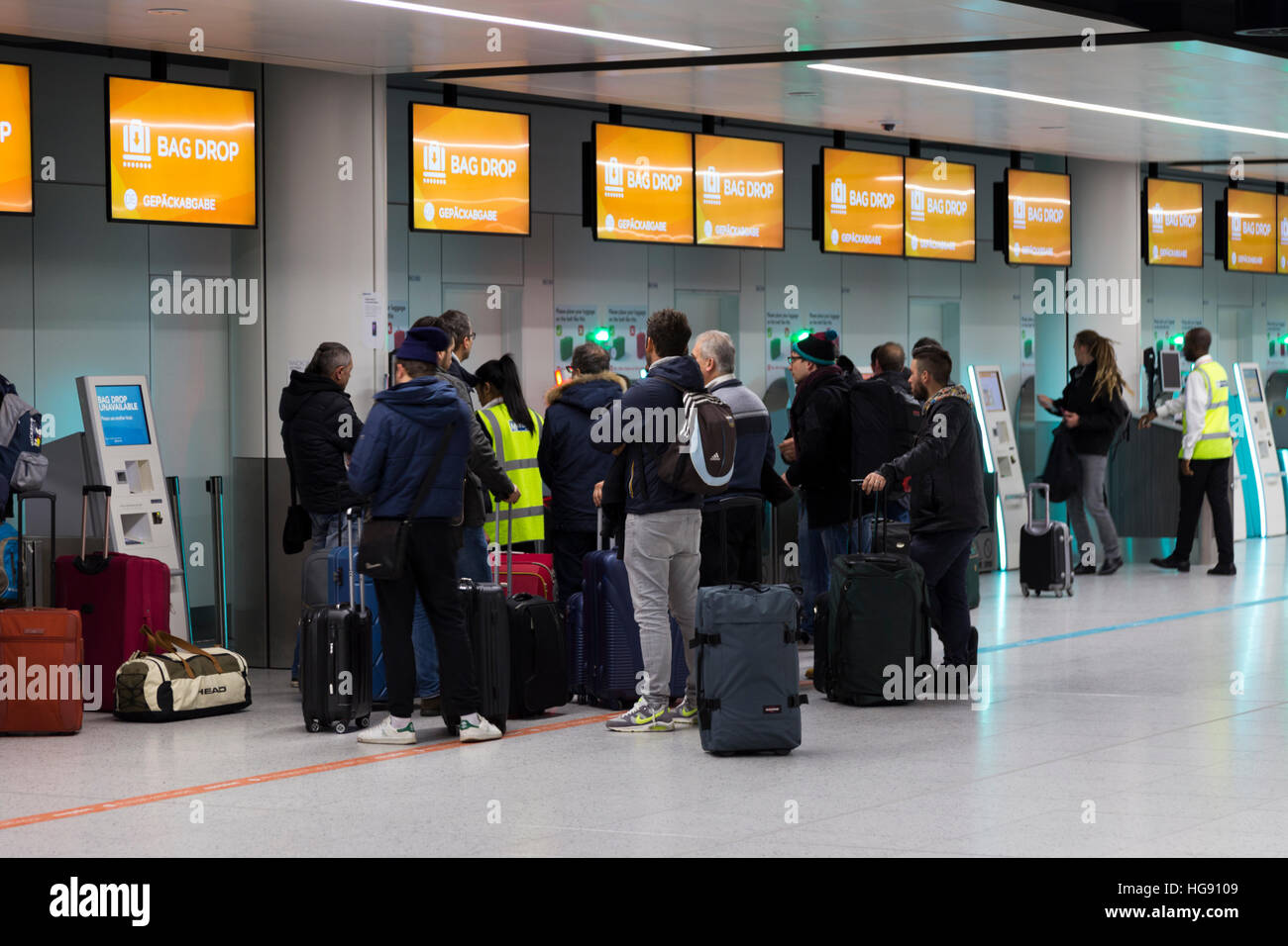Easyjet passenger bag drop baggage dropping off point for luggage check in  to be checked into hold on flight. Gatwick Airport UK Stock Photo - Alamy