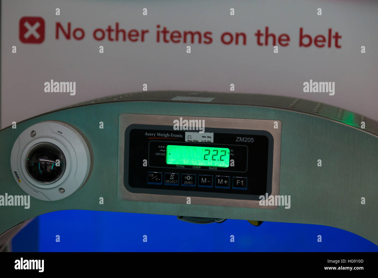 Airport check in KG weighing scale / scales display to weigh passenger bags baggage / luggage