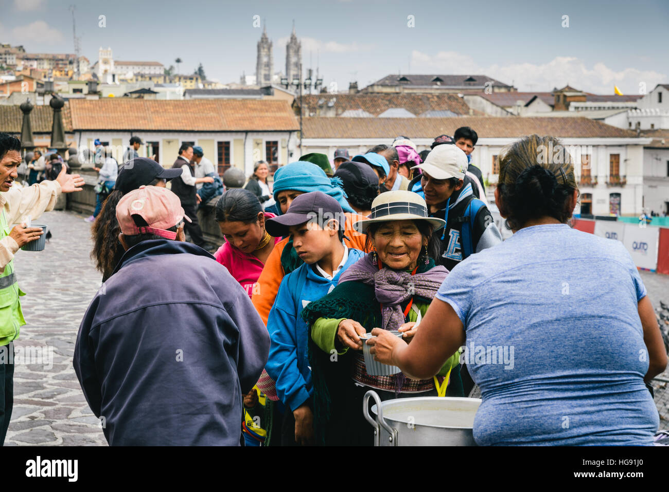 Unidentified Ecuadorian women with bowler hats. 71,9% of Ecuadorian people belong to the Mestizo ethnic group during food drive Stock Photo