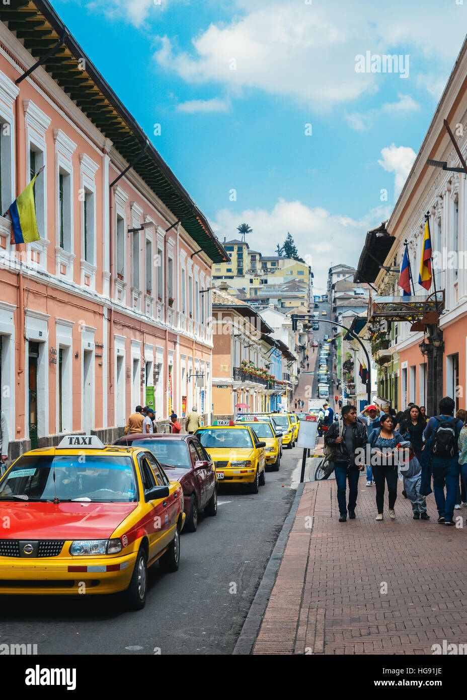 The old historic town of Quito (Unesco World Heritage Site) in Ecuador with its traditional yellow taxis Stock Photo
