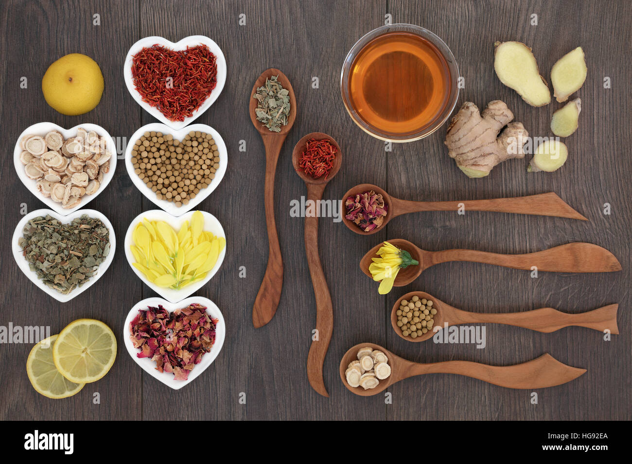 Medicinal chinese herb tea selection in heart shaped bowls and wooden