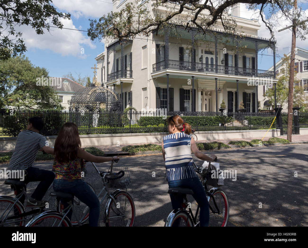 Our Mother of Perpetual Help chapel house, Garden District, New Orleans. Tourists on a bicycle tour visit the historic house. Stock Photo